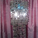 Set the mood for festive with a silver chandelier and a colored bulb