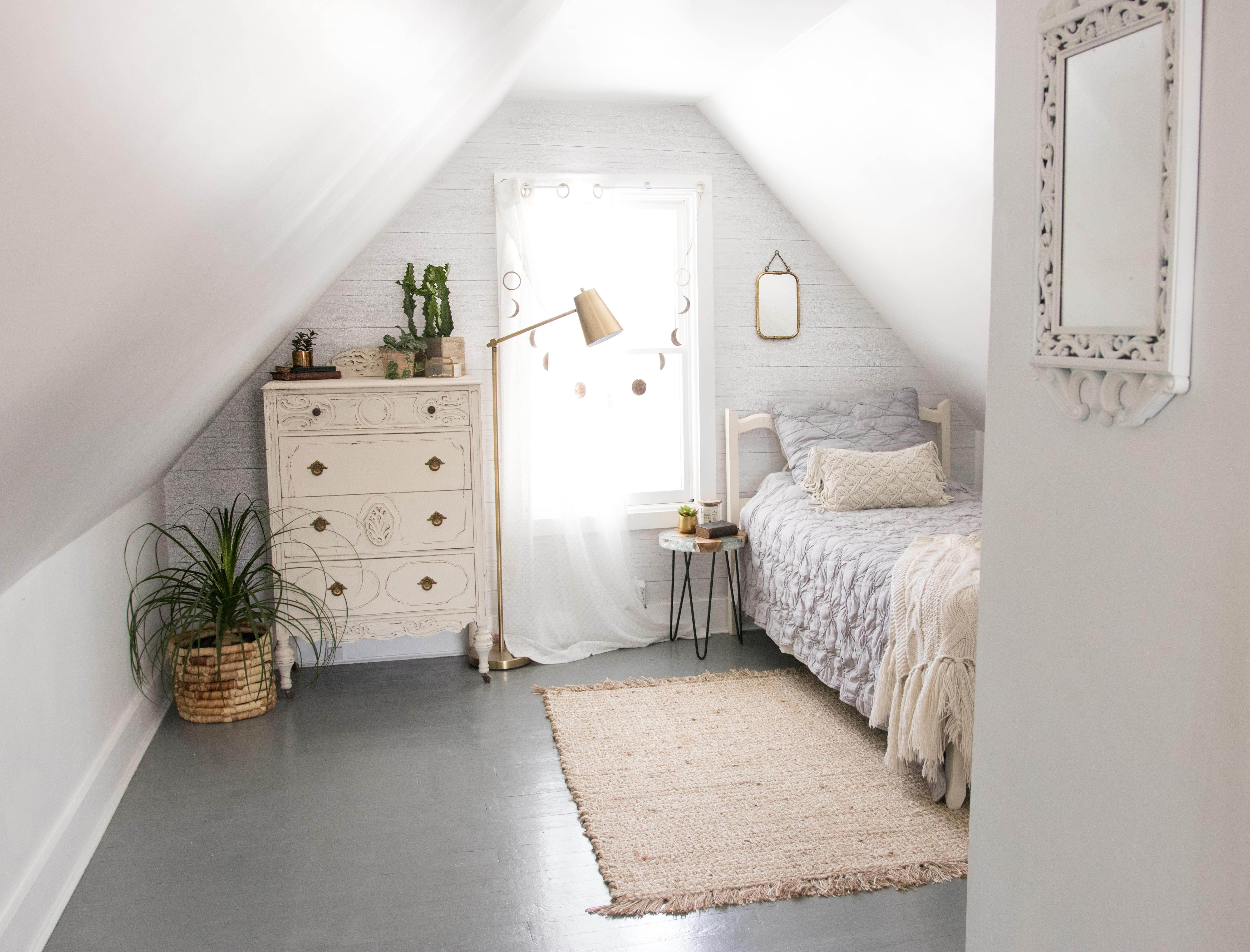 neutral loft a-frame bedroom with shiplap feature wall