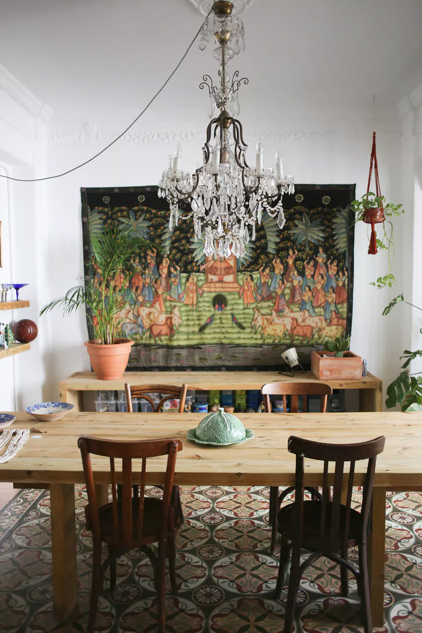 Eclectic boho dining room in Spain with intricate and unique floor tile