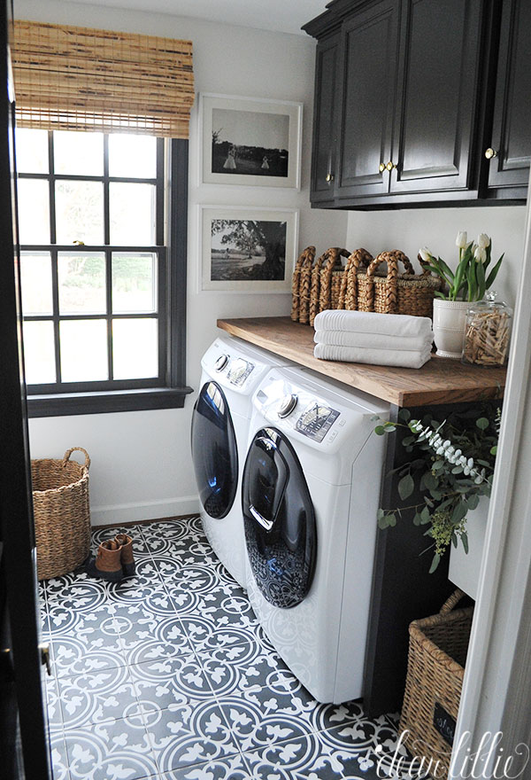 Laundry room makeover with black and white gothic floor tiles