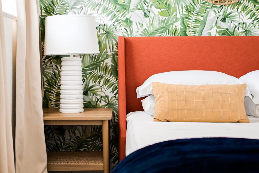 Bright and tropical peel and stick wallpaper bedroom design 
