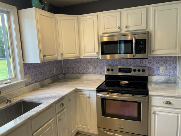 Beautiful blue kitchen backsplash can be achieved in one weekend with peel and stick embossed tiles by wallpops!